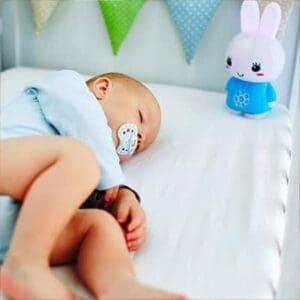 Baby sleeping with Blue Alilo Honey Bunny